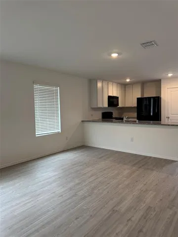 a kitchen with a stove and a microwave