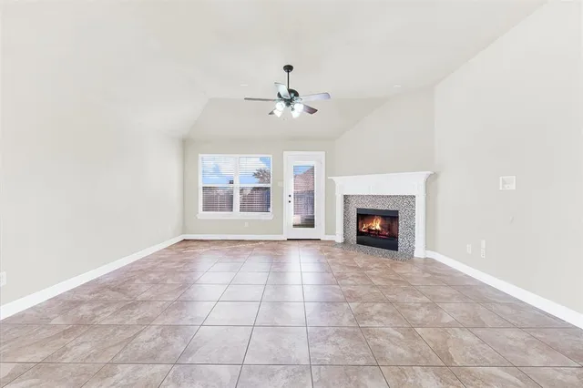 a view of an empty room with a fireplace