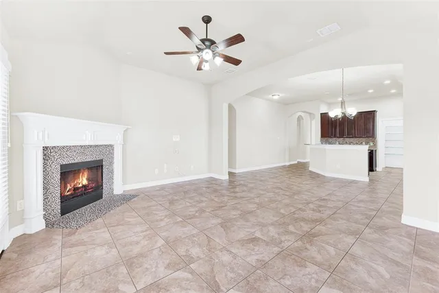 a view of a kitchen with a sink and a fireplace