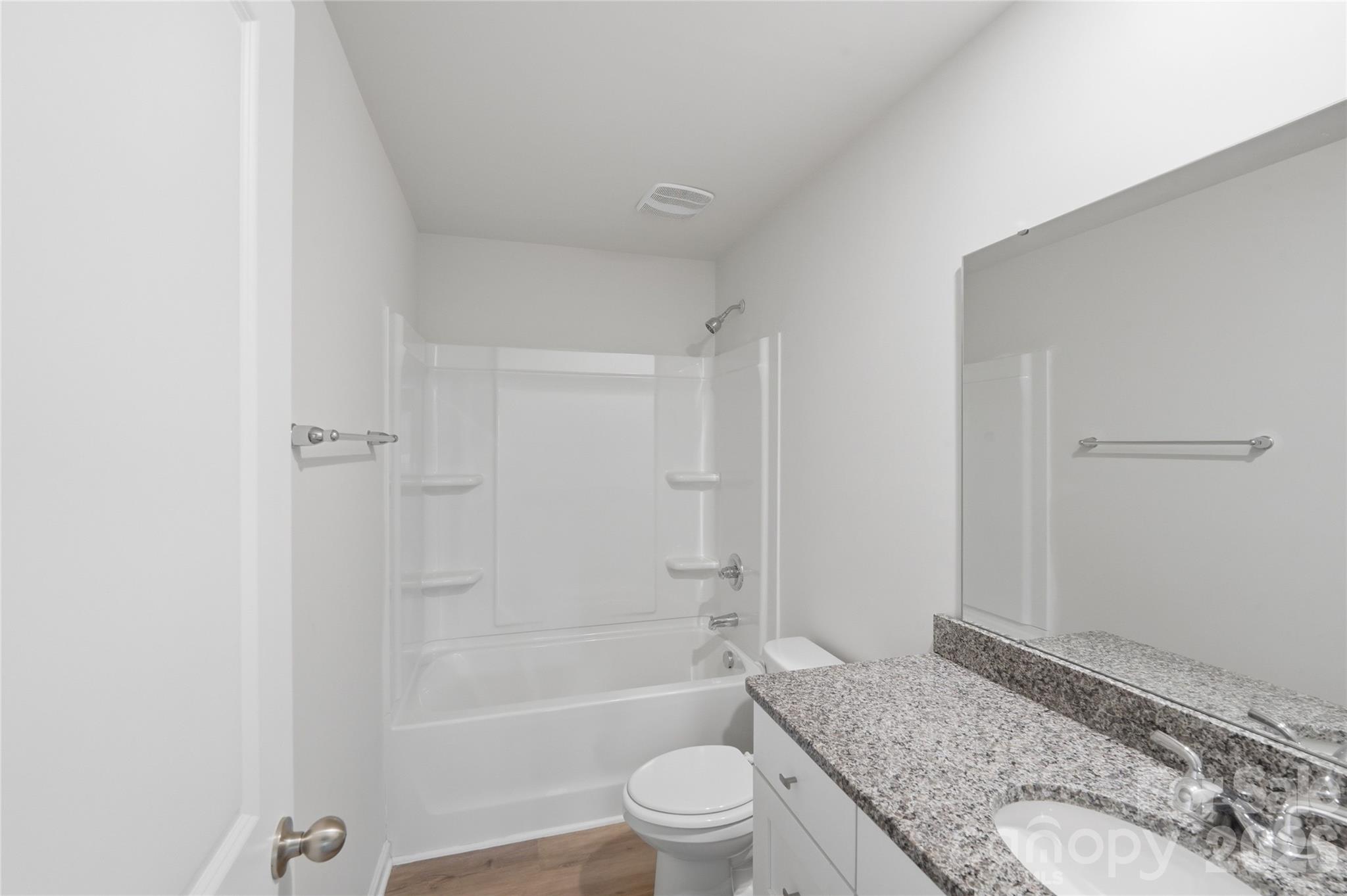 242 Landers Chapel Road Lincolnton, NC 28092 - Photo 5 of 33 a bathroom with a granite countertop bathtub shower sink vanity and toilet