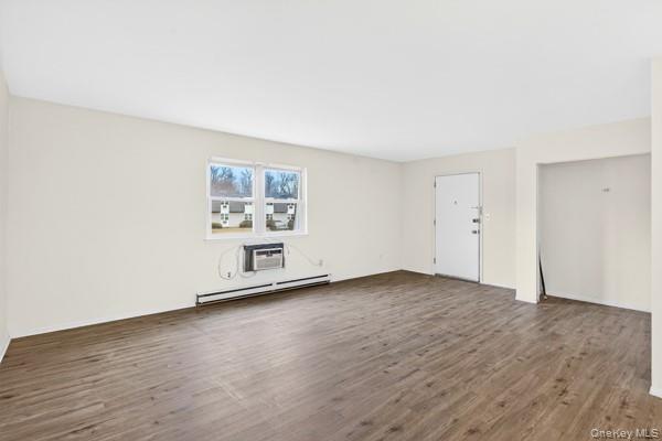 15 White Gate Road, Unit D Wappingers Falls, NY 12590 - Photo 6 of 16 an empty room with wooden floor and window