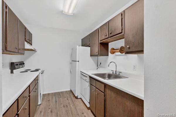 15 White Gate Road, Unit D Wappingers Falls, NY 12590 - Photo 7 of 16 a kitchen with stainless steel appliances granite countertop a sink stove and cabinets