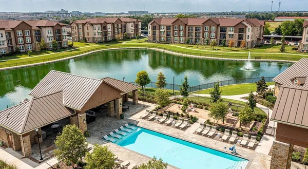an aerial view of a house with a swimming pool