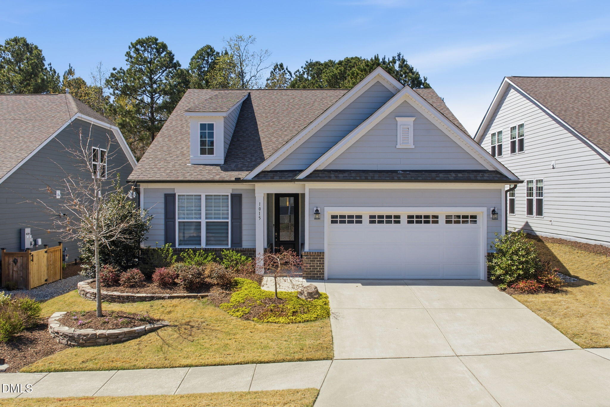 a front view of a house with garden