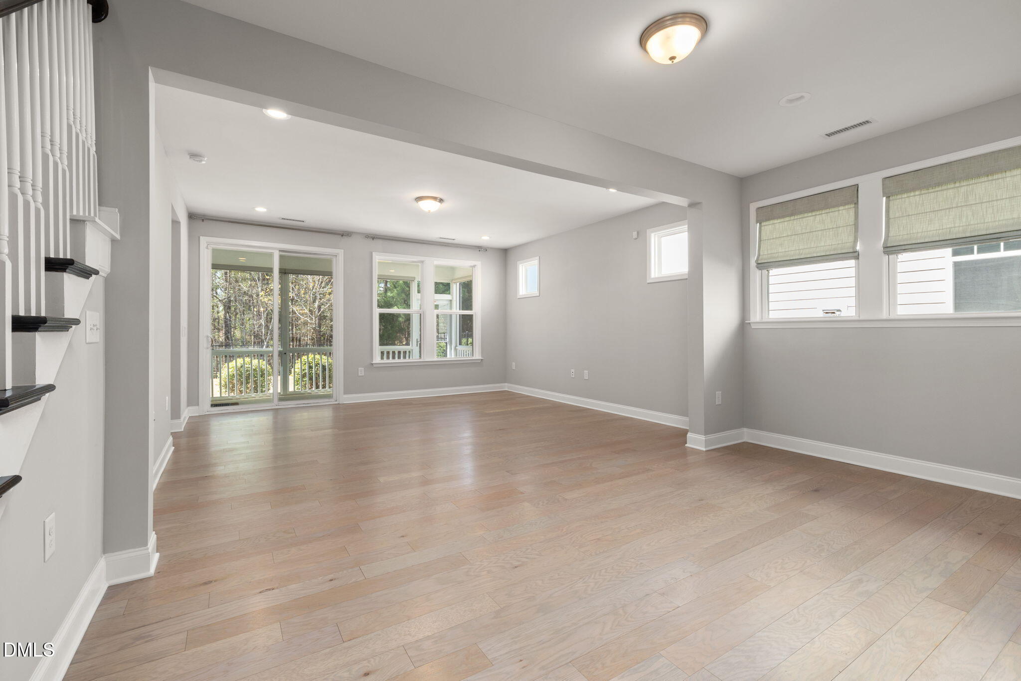 1015 Pondfield Way Durham, NC 27713 - Photo 13 of 48 an empty room with wooden floor and windows