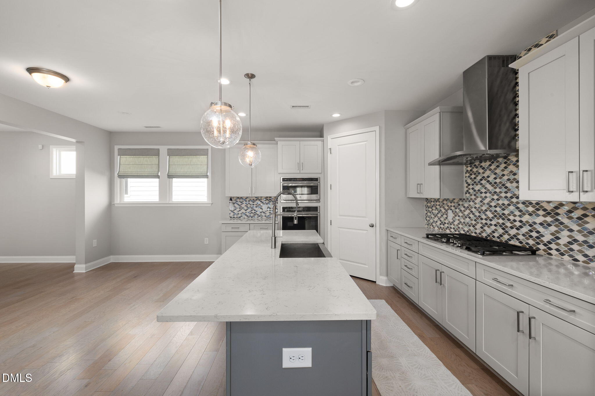 1015 Pondfield Way Durham, NC 27713 - Photo 15 of 48 a kitchen with stainless steel appliances granite countertop a sink a stove and a refrigerator