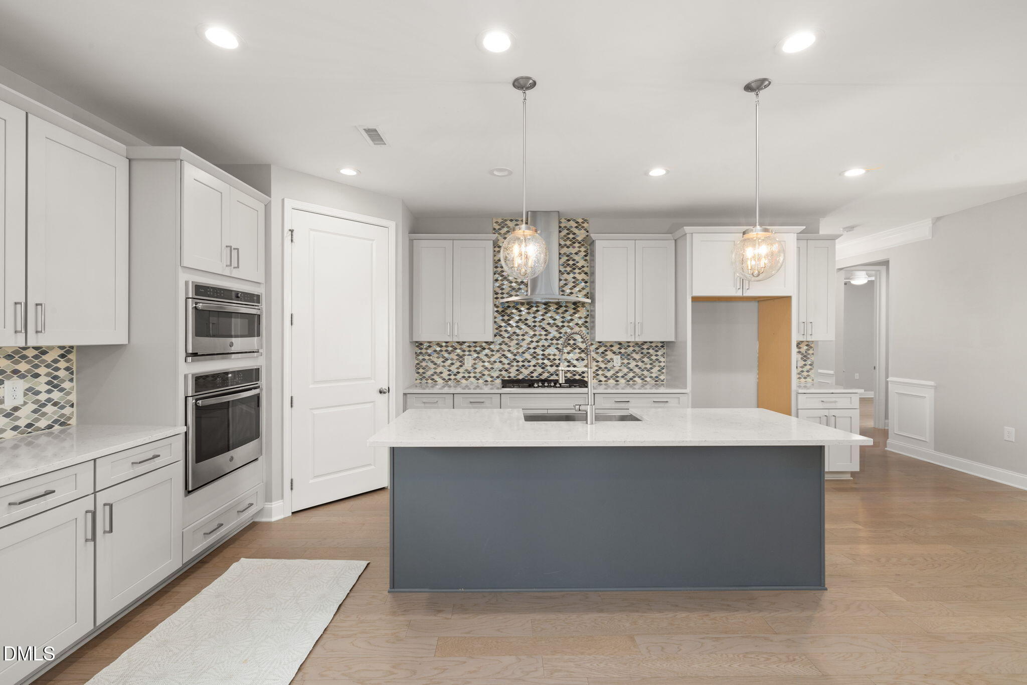 1015 Pondfield Way Durham, NC 27713 - Photo 17 of 48 a kitchen with stainless steel appliances kitchen island a sink stove and cabinets