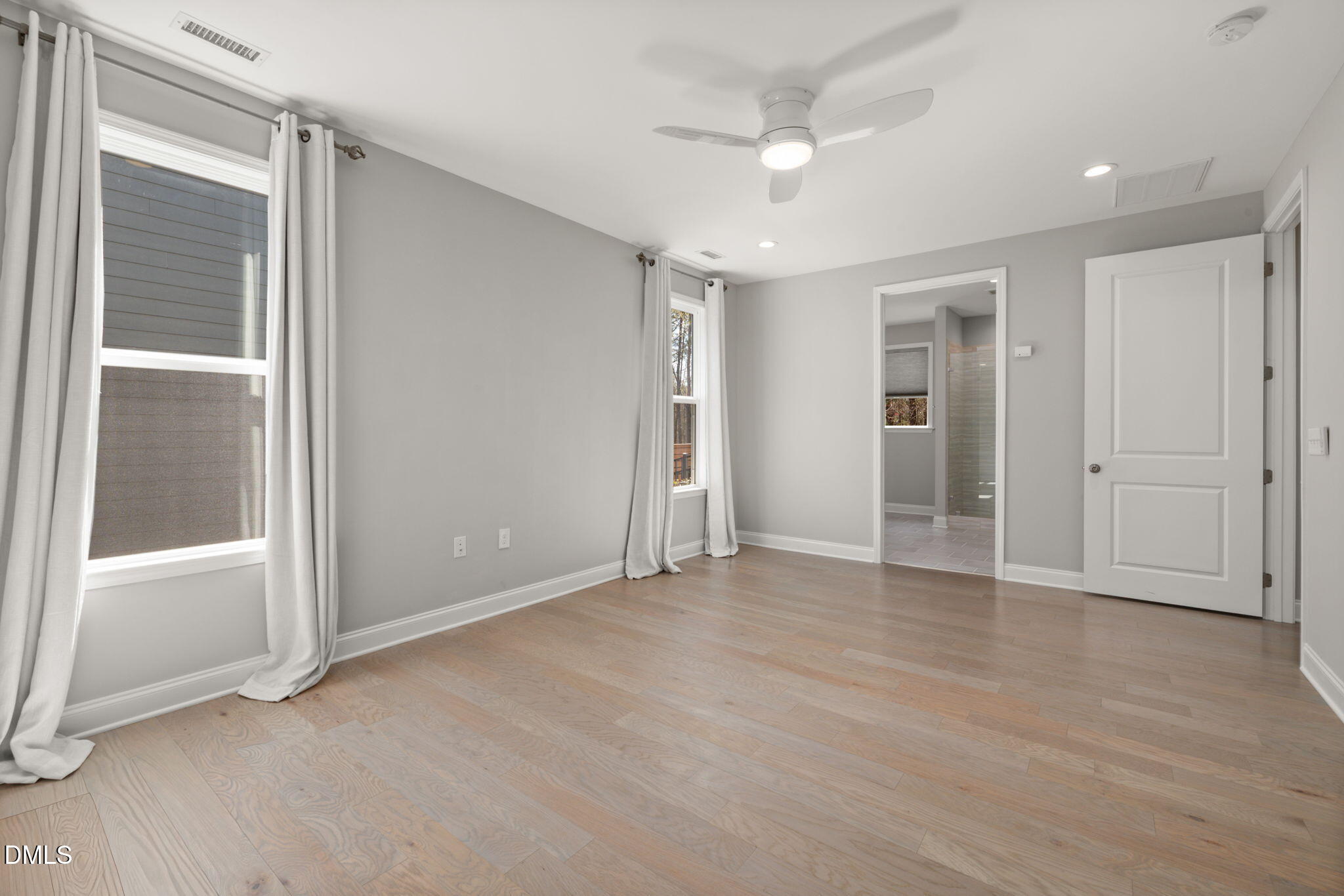1015 Pondfield Way Durham, NC 27713 - Photo 23 of 48 an empty room with closet and a ceiling fan