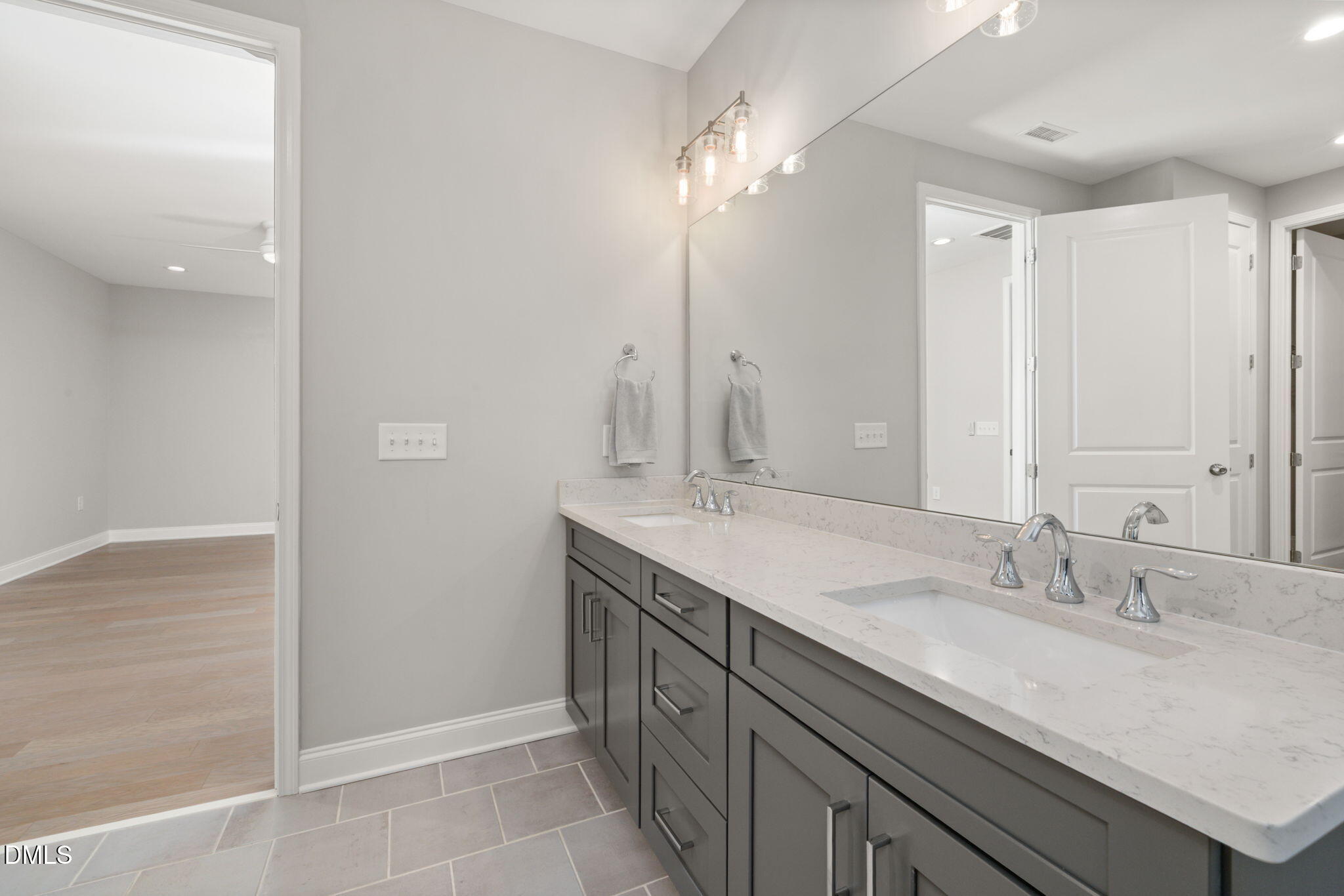 1015 Pondfield Way Durham, NC 27713 - Photo 27 of 48 a bathroom with a granite countertop sink and a mirror