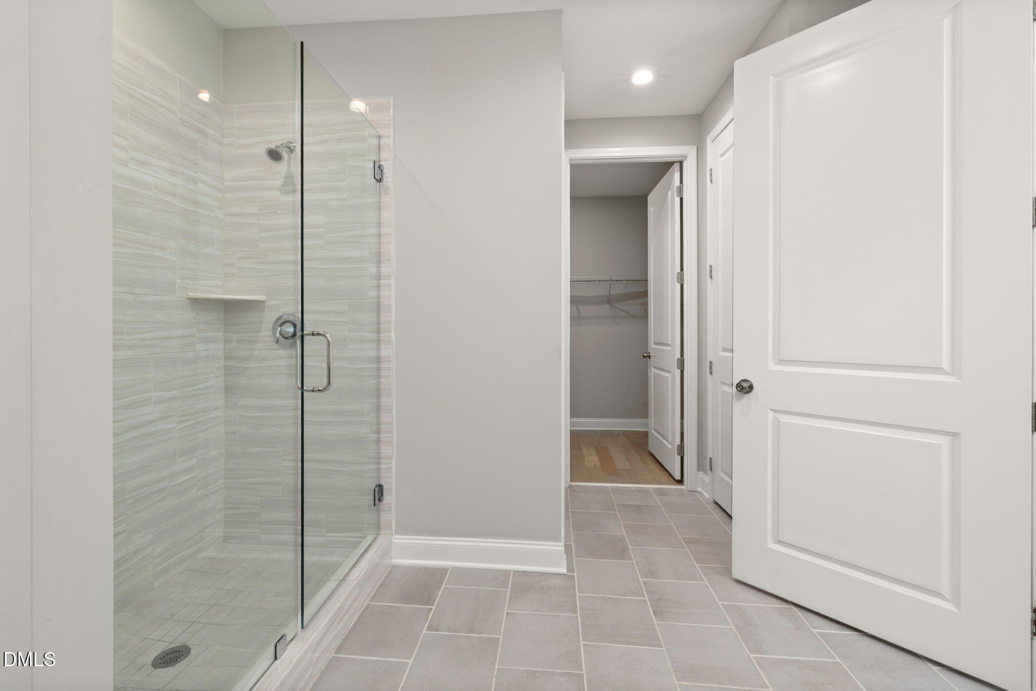 1015 Pondfield Way Durham, NC 27713 - Photo 28 of 48 a bathroom with a shower and a glass door
