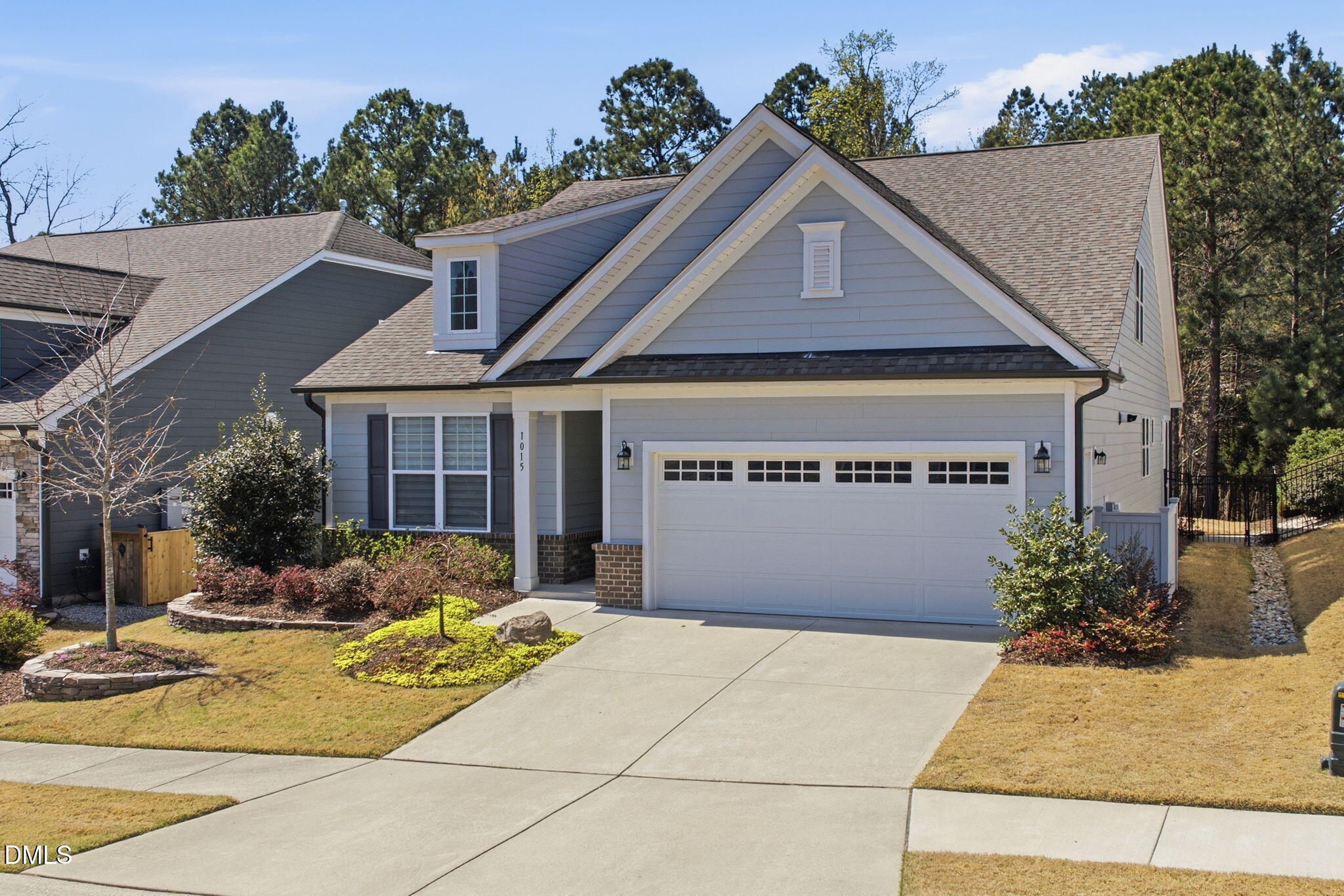 1015 Pondfield Way Durham, NC 27713 - Photo 2 of 48 a front view of house with garage and yard