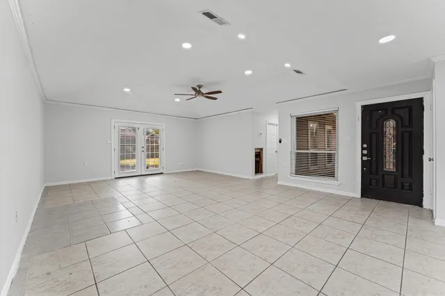 a view of a refrigerator and window in a room