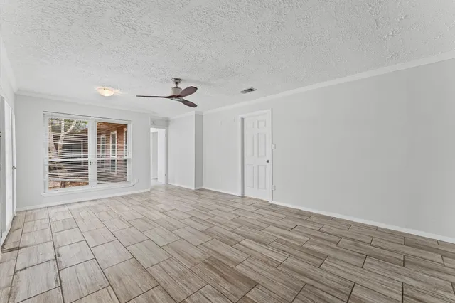 a bathroom with a granite countertop sink a shower and a mirror