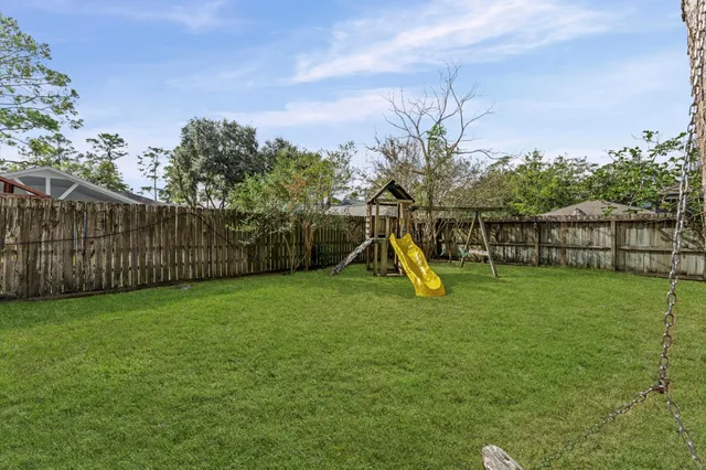 a view of a backyard with a slide
