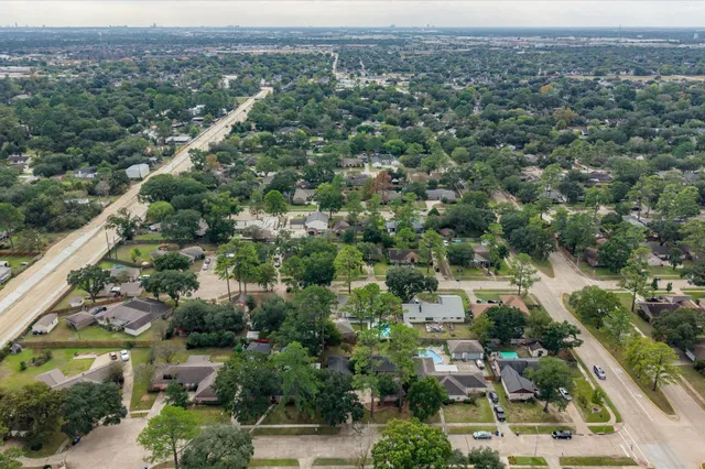 an aerial view of a city with lots of residential buildings