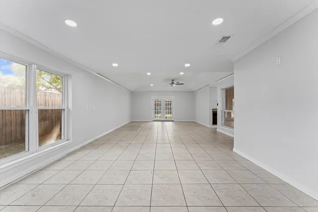 a view of kitchen with furniture and a refrigerator