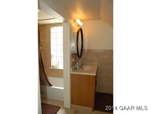 356 Lofton Road Raphine, VA 24472 - Photo 14 of 36 a view of a bathroom with a sink and mirror