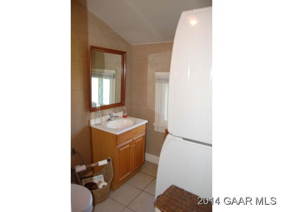 356 Lofton Road Raphine, VA 24472 - Photo 18 of 36 a bathroom with a sink and mirror