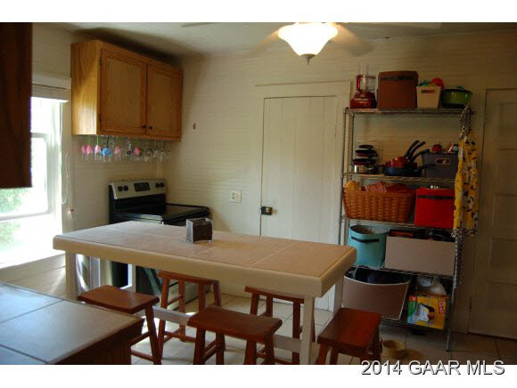 356 Lofton Road Raphine, VA 24472 - Photo 2 of 36 a view of a dining room with furniture and wooden floor