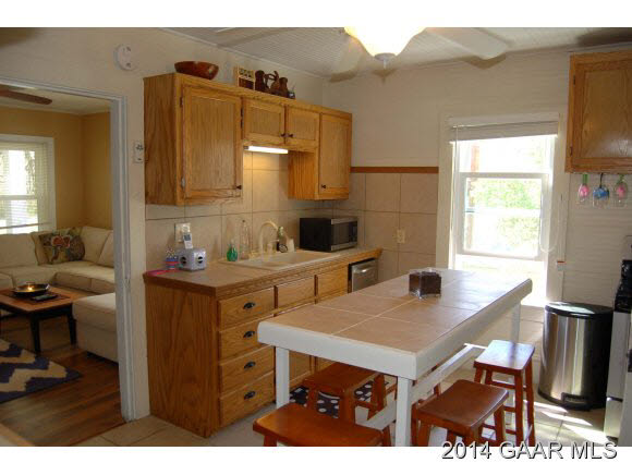 356 Lofton Road Raphine, VA 24472 - Photo 4 of 36 a kitchen with a sink cabinets and a window