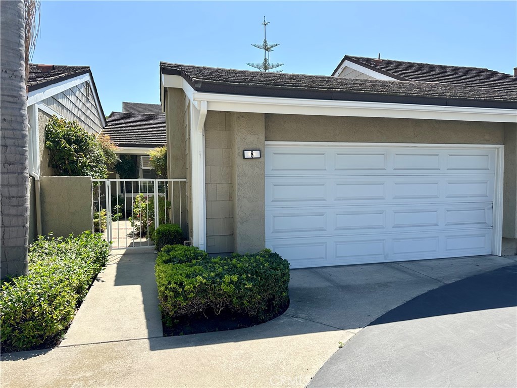 8 Coldstream Irvine, CA 92604 - Photo 1 of 27 a front view of a house with a yard