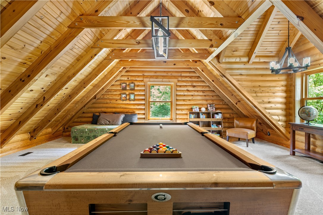 1784 North Medina Line Road Akron, OH 44333 - Photo 28 of 50 Playroom featuring carpet floors, wooden ceiling, log walls, billiards table, and a chandelier