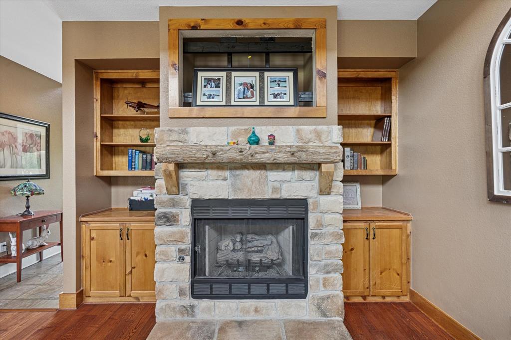 6251 Hayes Road Midlothian, TX 76065 - Photo 11 of 30 a living room with furniture and a fireplace