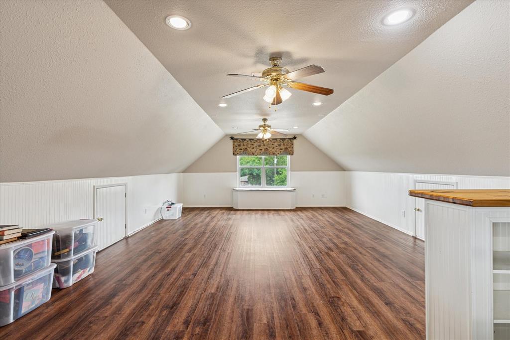 6251 Hayes Road Midlothian, TX 76065 - Photo 14 of 30 a view of empty room with wooden floor and fan