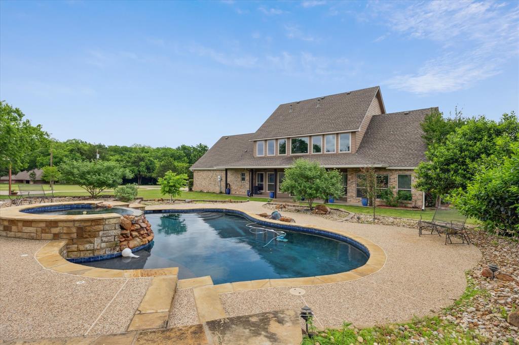 6251 Hayes Road Midlothian, TX 76065 - Photo 2 of 30 a view of a house with swimming pool and sitting area