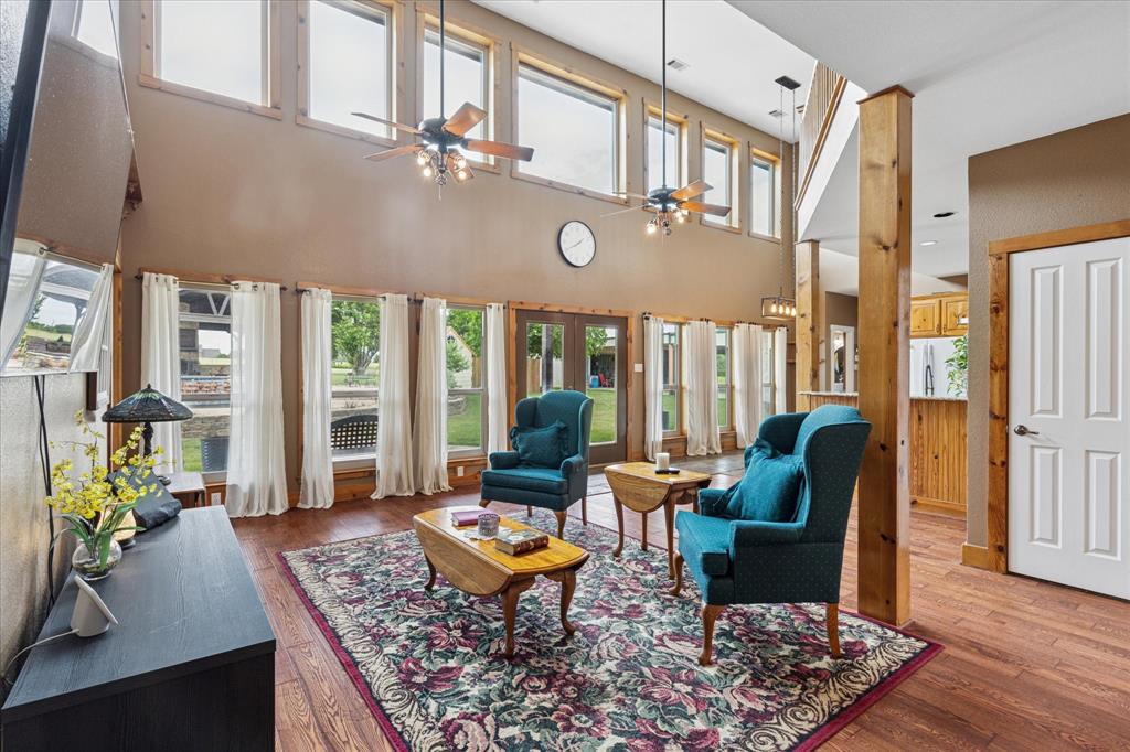 6251 Hayes Road Midlothian, TX 76065 - Photo 5 of 30 a living room with furniture a rug and a floor to ceiling window