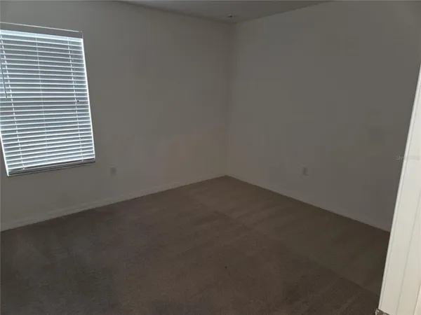 a view of a room that has a window in it