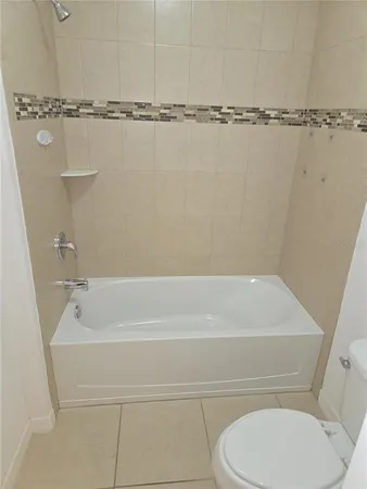 a bathroom with a shower and a toilet