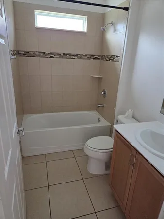 a bathroom with a toilet a sink and a shower