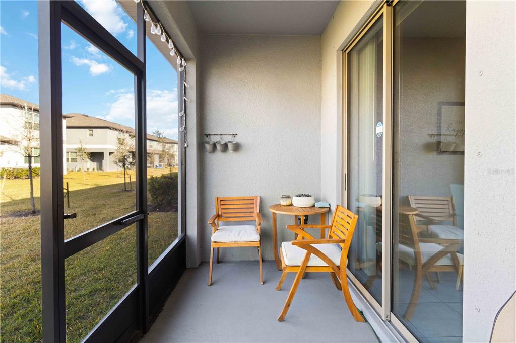 14339 Easy Goer Street Ruskin, FL 33573 - Photo 20 of 49 a view of a room with a dining table and chairs