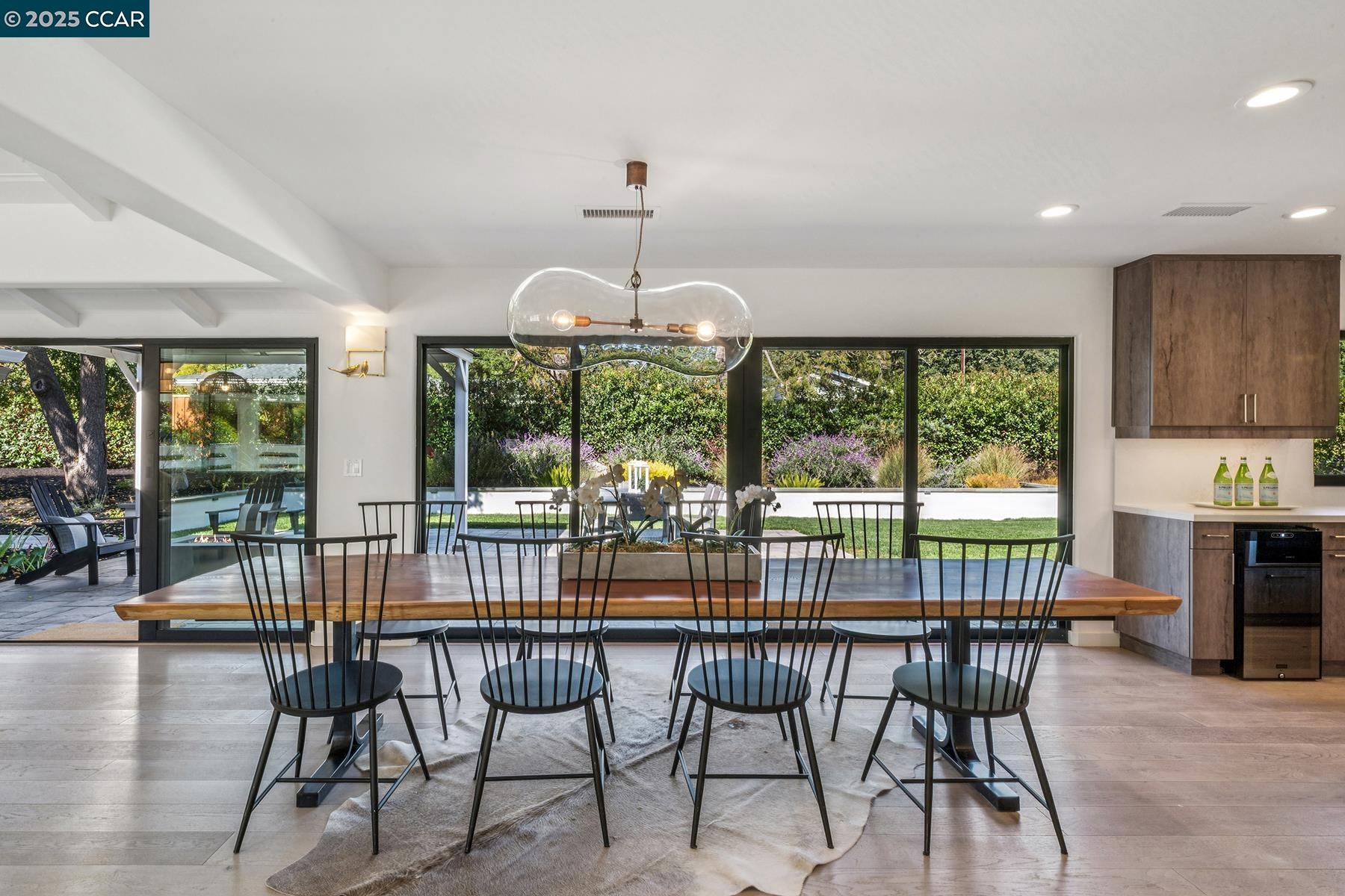 3958 Franke Lane Lafayette, CA 94549 - Photo 12 of 44 a dining room with furniture a chandelier and wooden floor