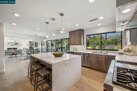 a kitchen with stainless steel appliances granite countertop counter space and a sink