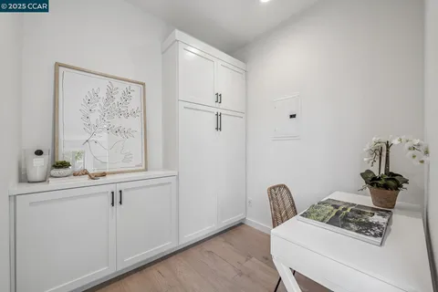 a large bathroom with double vanity and a bathtub