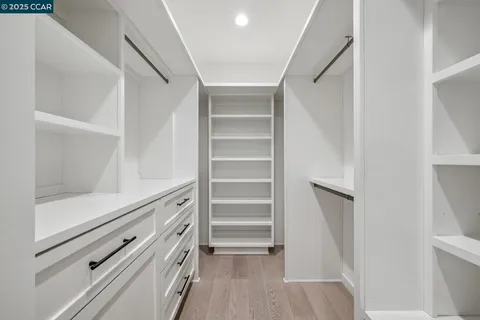 a view of house with outdoor seating and green space