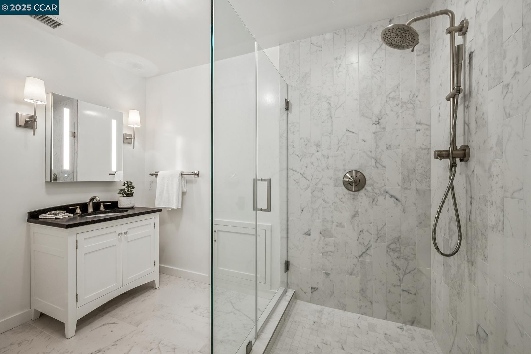 3958 Franke Lane Lafayette, CA 94549 - Photo 39 of 44 a bathroom with a granite countertop shower a mirror and a sink