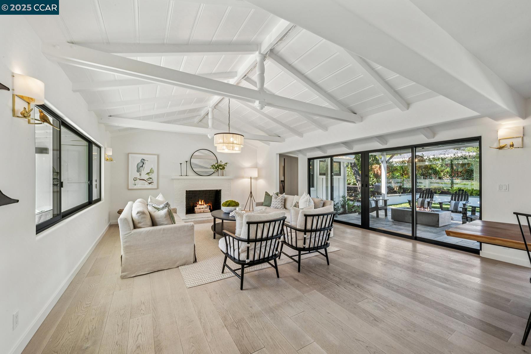 3958 Franke Lane Lafayette, CA 94549 - Photo 6 of 44 a living room with furniture a fireplace and a large window