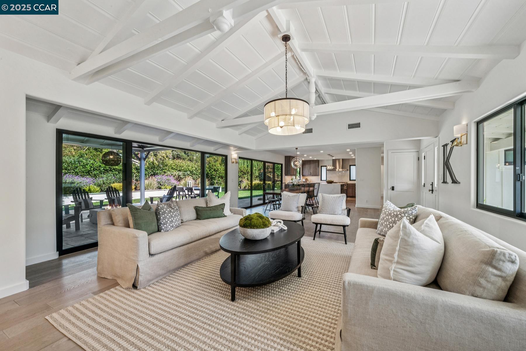 3958 Franke Lane Lafayette, CA 94549 - Photo 8 of 44 a living room with furniture and a chandelier