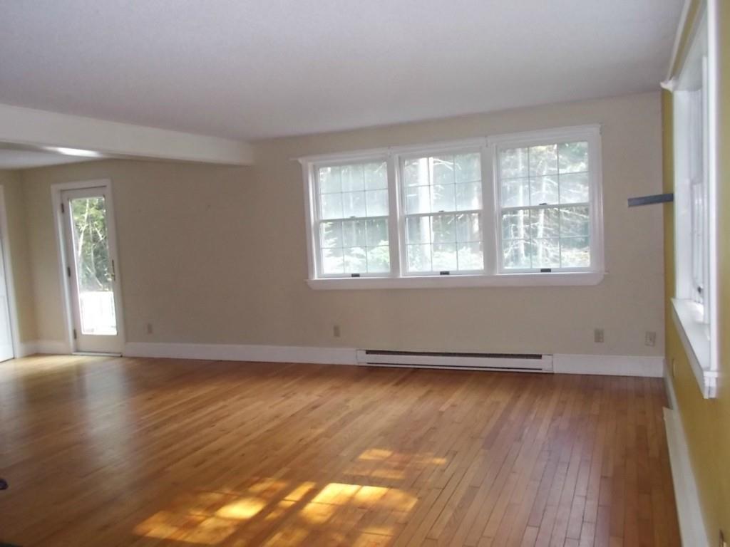 28 Upper Spruce Shore Road Harpswell, ME 04079 - Photo 8 of 21 Living room with door to sunlit deck.