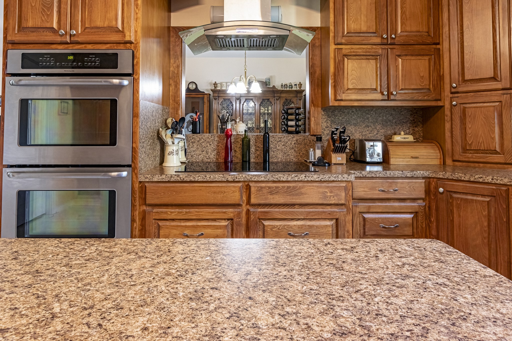 188 Pullin Road Corrigan, TX 75939 - Photo 9 of 50 a kitchen with stainless steel appliances granite countertop a stove and cabinets