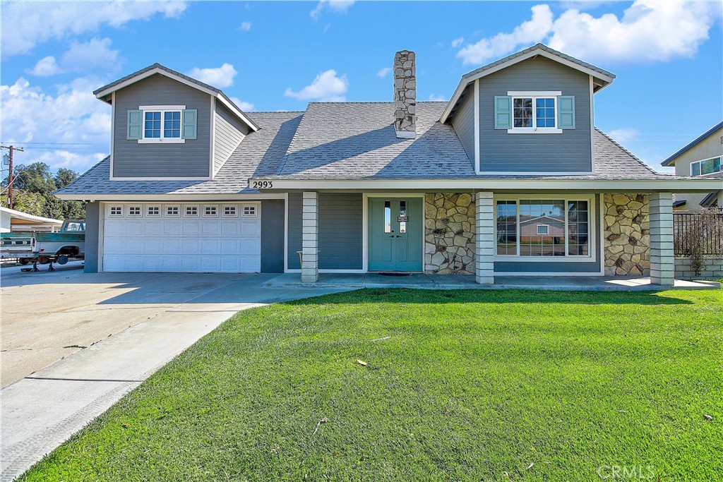 2993 Mary Street Riverside, CA 92506 - Photo 1 of 1 a front view of a house with garden