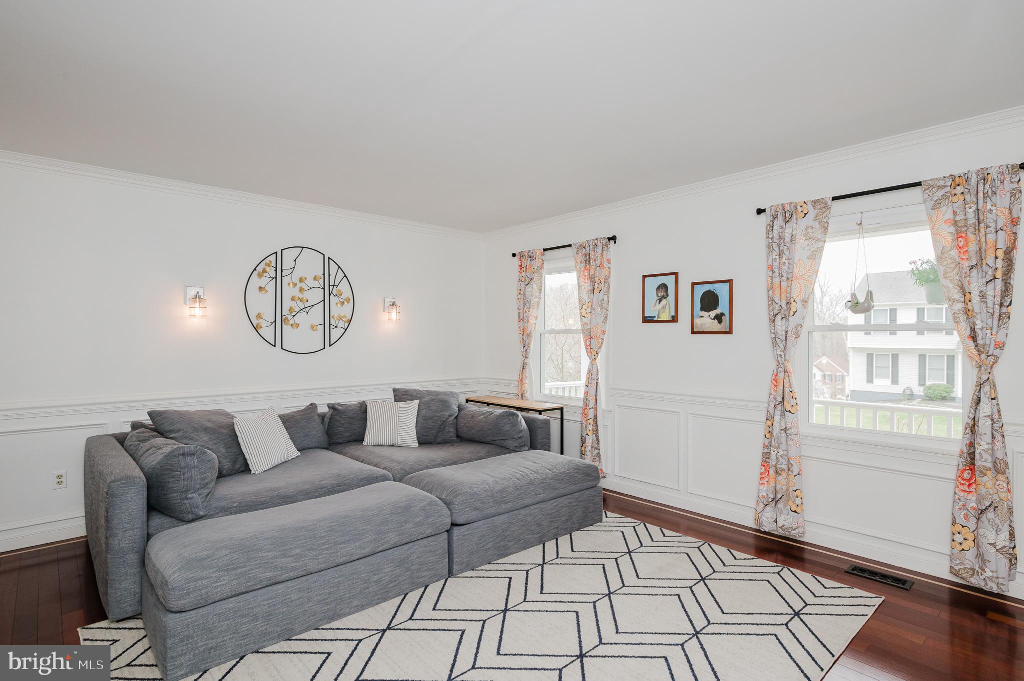 9528 Hallhurst Road Baltimore, MD 21236 - Photo 7 of 65 a living room with furniture and a window