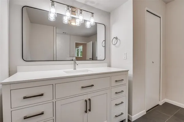 a bathroom with a shower and toilet
