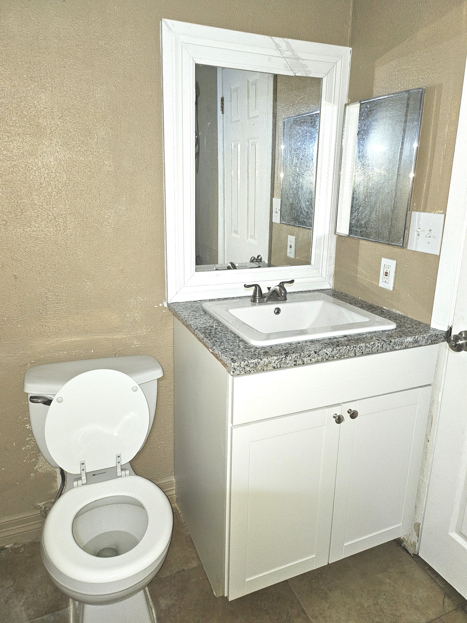 15829 Ridgeroe Lane Houston, TX 77053 - Photo 13 of 15 a bathroom with a granite countertop toilet sink and mirror