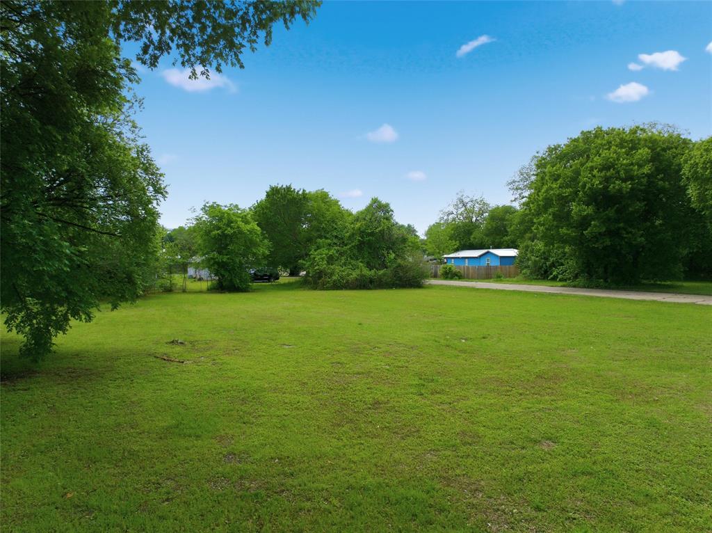 1121 Forrest Street Waco, TX 76704 - Photo 4 of 10 a view of outdoor space with deck and yard