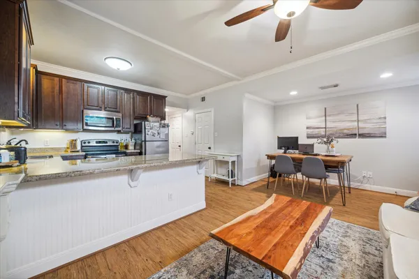 a sign board with palm trees