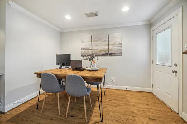 a living room with fireplace furniture and a flat screen tv